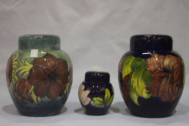 Appraisal: A PAIR OF MOORCROFT FREESIA PATTERN GINGER JARS and covers