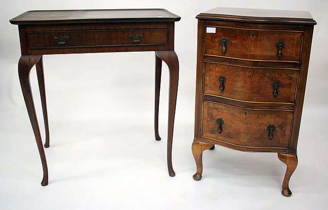 Appraisal: A SMALL WALNUT SERPENTINE NEST OF THREE SHORT DRAWERS with