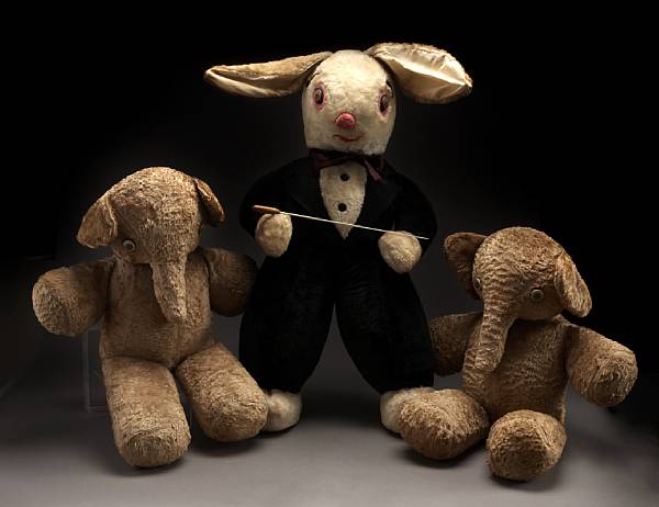 Appraisal: A large stuffed toy white rabbit dressed in tuxedo with