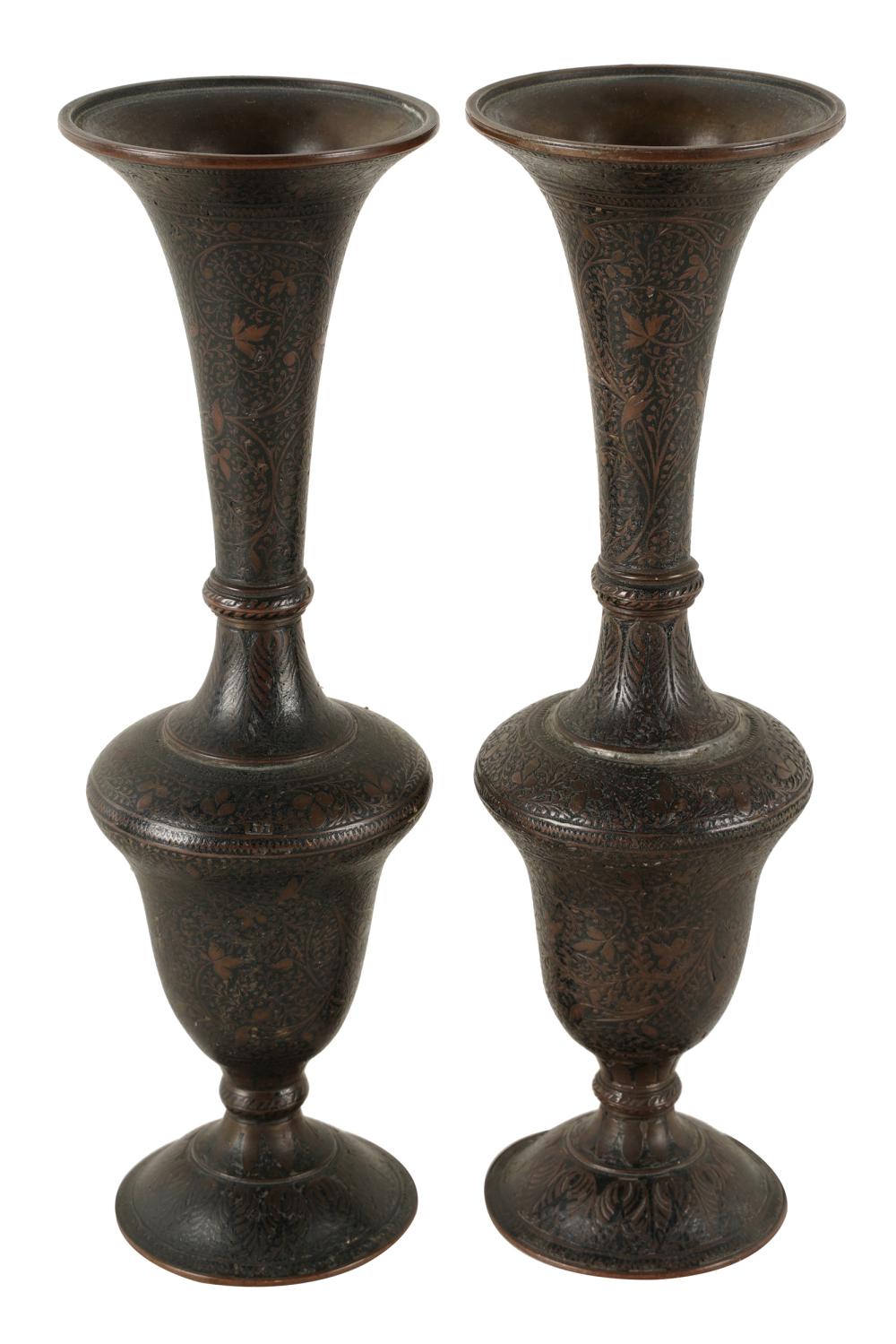 Appraisal: PAIR OF PERSIAN DAMASCENE BUD VASESwith foliate design each inches