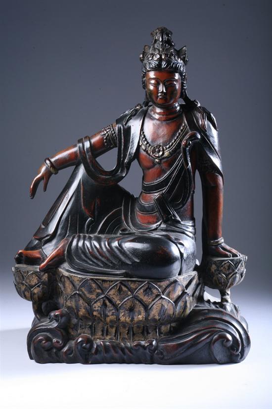 Appraisal: CHINESE WOOD FIGURE OF GUANYIN Seated at ease wearing diadem