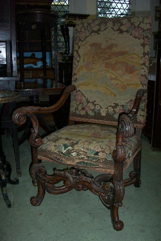 Appraisal: A substantial Carolean style walnut armchair with scrolled arms supports