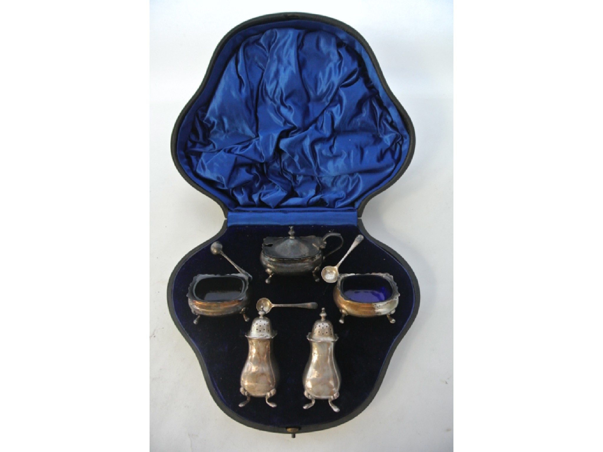 Appraisal: A cased Edwardian silver cruet set Walker Hall Sheffield comprising