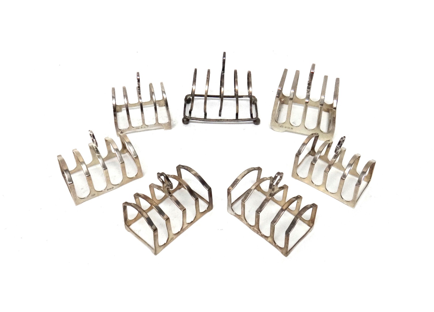 Appraisal: A set of four silver toast racks Birmingham maker Adie