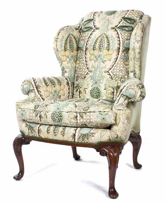 Appraisal: A Queen Anne Style Wingback Armchair the upholstered back arms