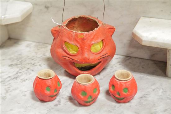 Appraisal: FOUR PAPIER MACHE JACK-O-LANTERNS Cat with metal handle and black