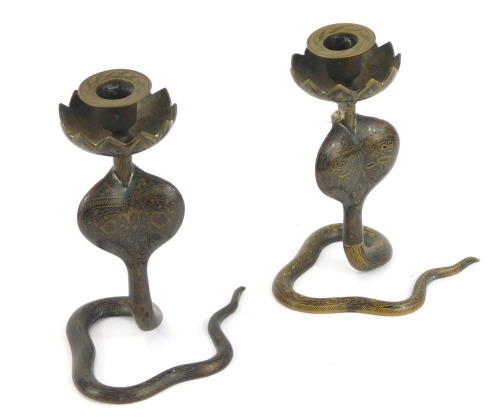 Appraisal: A pair of early thC Indian brass and niello candlesticks