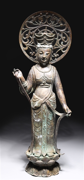 Appraisal: Chinese bronze metal deity atop lotus form base some wear