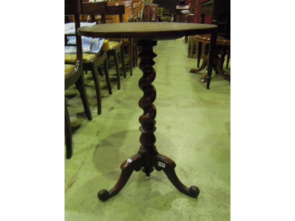 Appraisal: A Victorian mahogany occasional table with circular top raised on