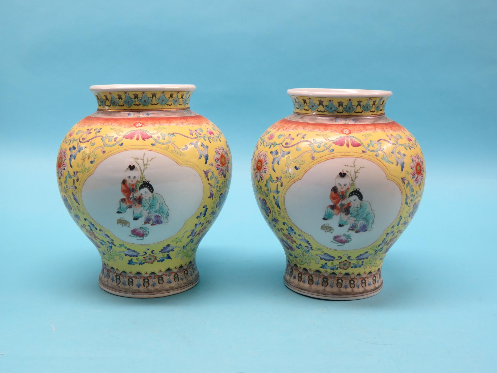 Appraisal: A pair of Chinese porcelain vases baluster-shape painted with children