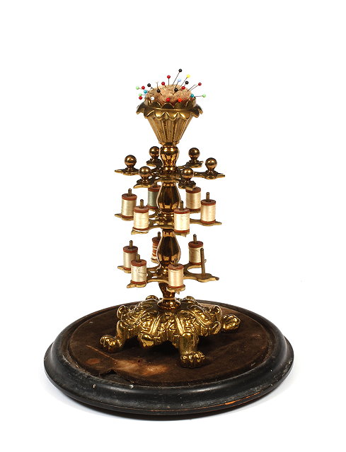 Appraisal: A VICTORIAN CAST AND PIERCED BRASS THREAD STAND with pin