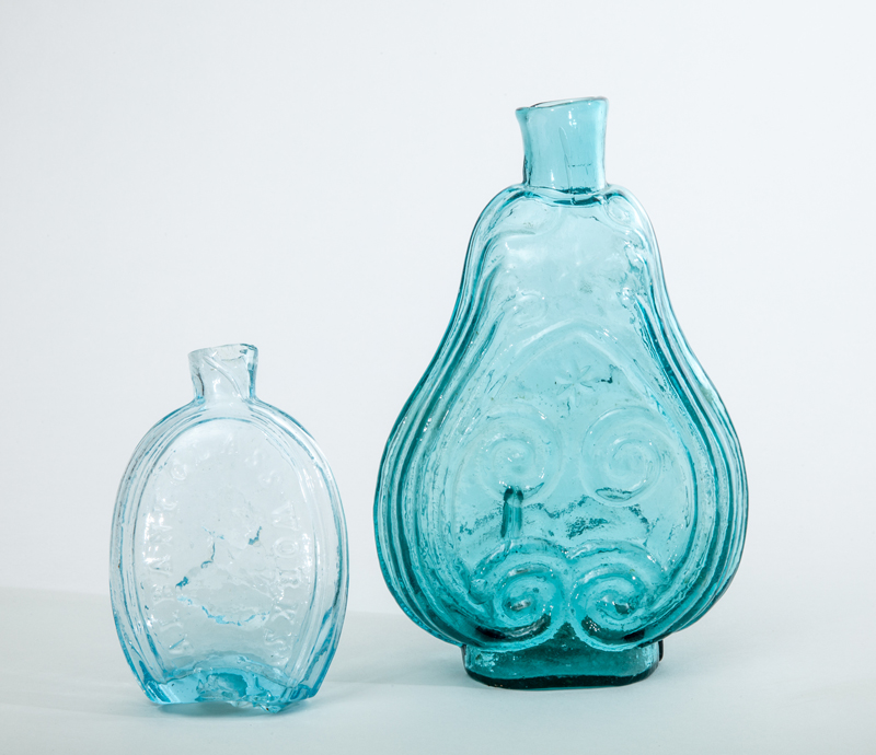 Appraisal: TWO AMERICAN PRESSED GLASS FLASKS Comprising a violin and scroll