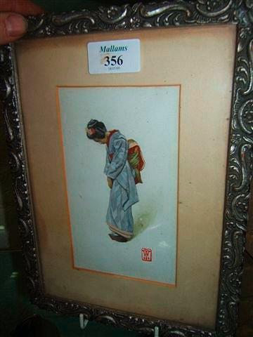 Appraisal: An Edwardian watercolour picture of a Japanese woman wearing a