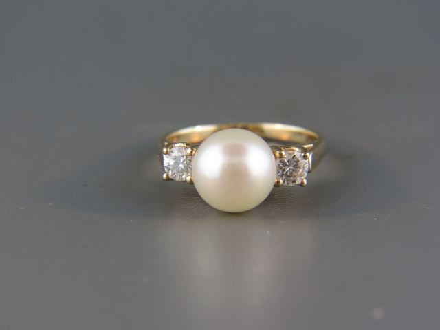 Appraisal: Pearl and Diamond Ring lusterous mm pearl with diamond on