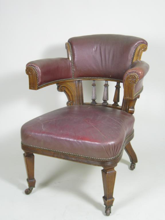 Appraisal: An Edwardian walnut Library Armchair with rounded upholstered back stuff-over