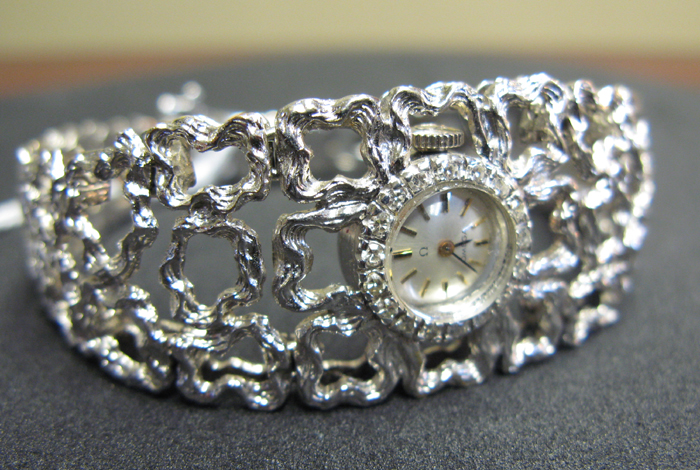 Appraisal: LADY'S FOURTEEN KARAT WHITE GOLD OMEGA BRACELET WATCH WITH APPRAISAL