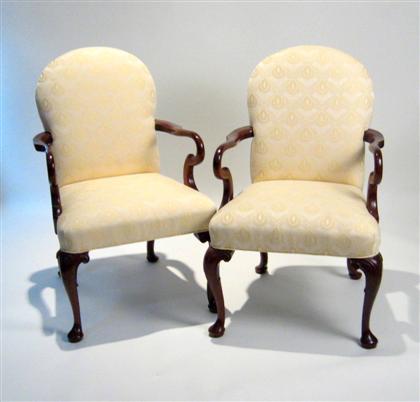 Appraisal: Pair of George II style upholstered mahogany armchairs Each with