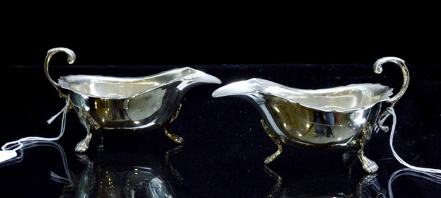 Appraisal: A matched pair of silver plated sauce boats