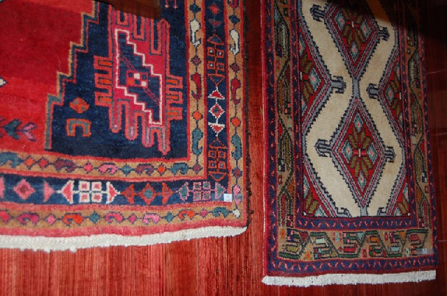 Appraisal: A PERSIAN FLOOR RUG In tones of blue and red