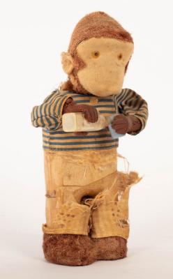 Appraisal: An Alps Toy Co clockwork monkey drinking milk cm high