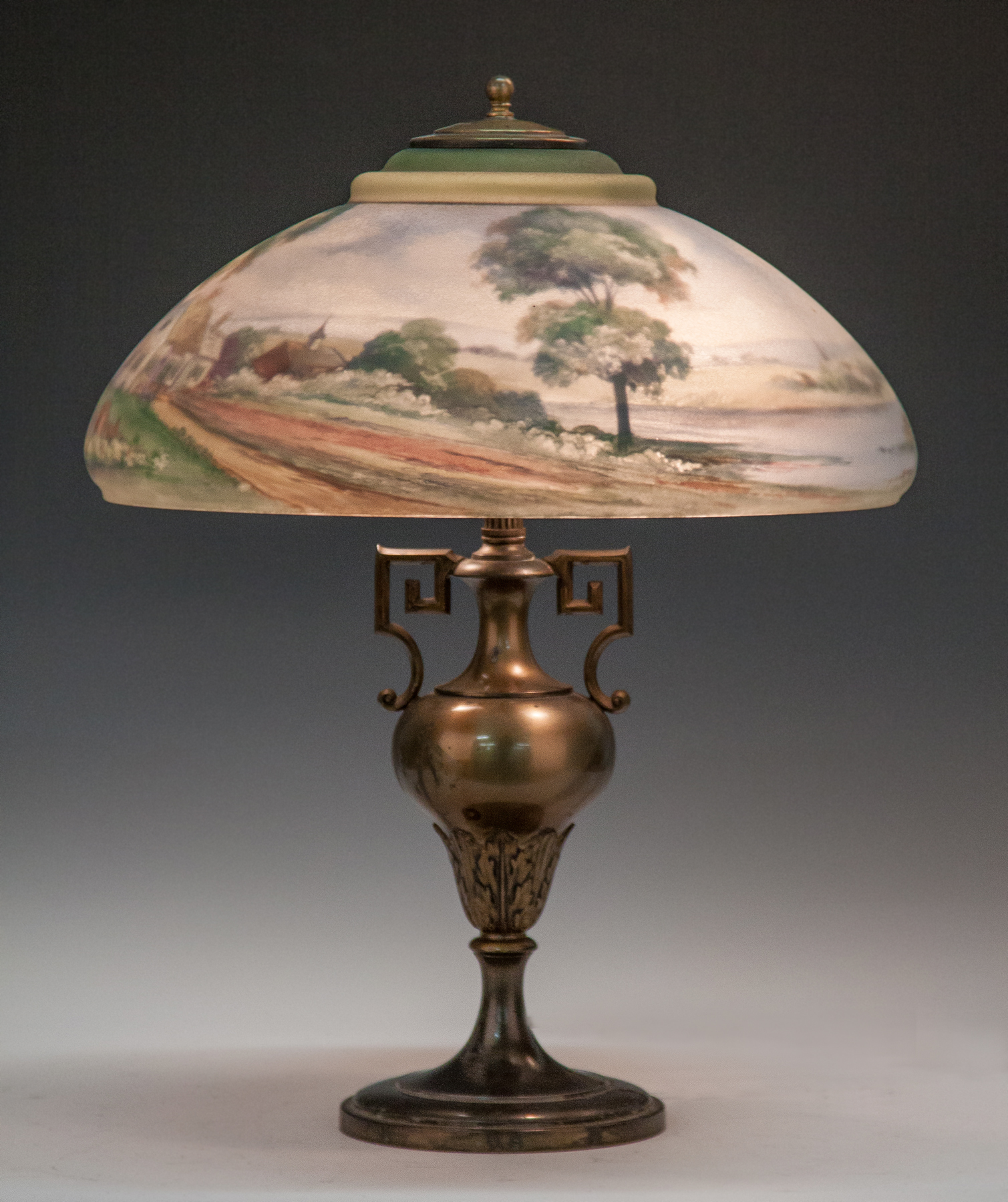 Appraisal: Reverse Painted Pairpoint Lamp with Lake Scene Cottage Church Signed