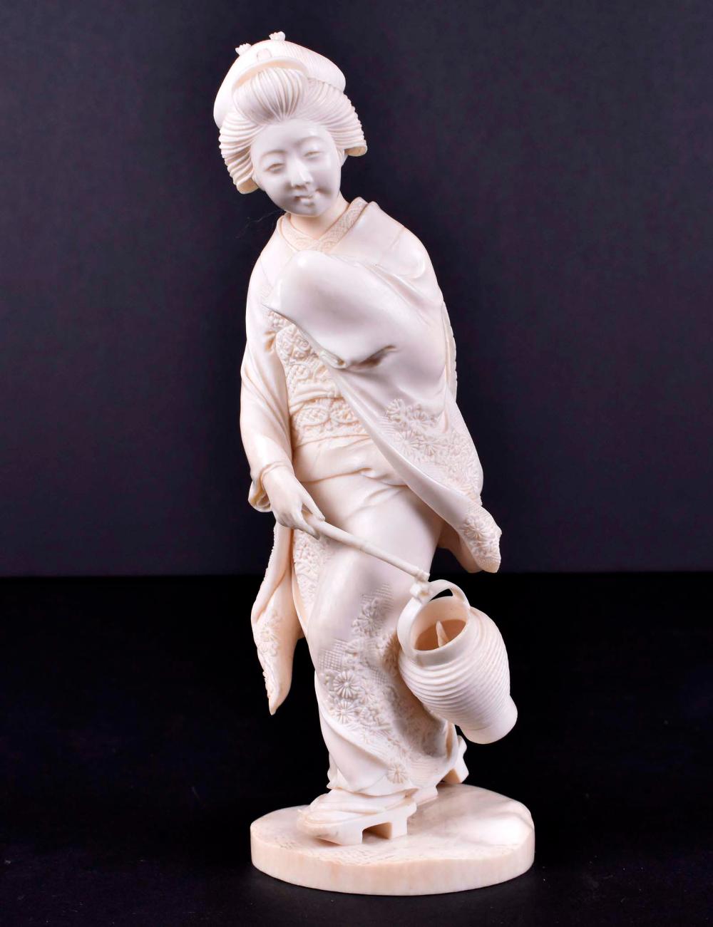 Appraisal: JAPANESE OKIMONO OF A WOMAN WALKING IN THE WINDMeiji Period