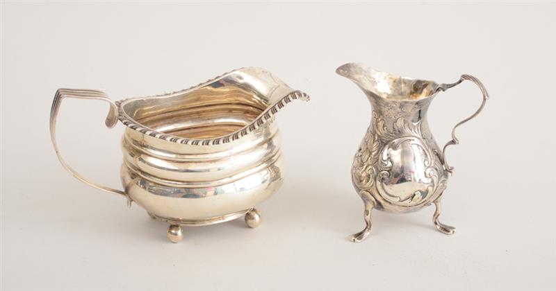 Appraisal: GEORGE II SILVER TRIPOD CREAMER AND A GEORGE III SILVER