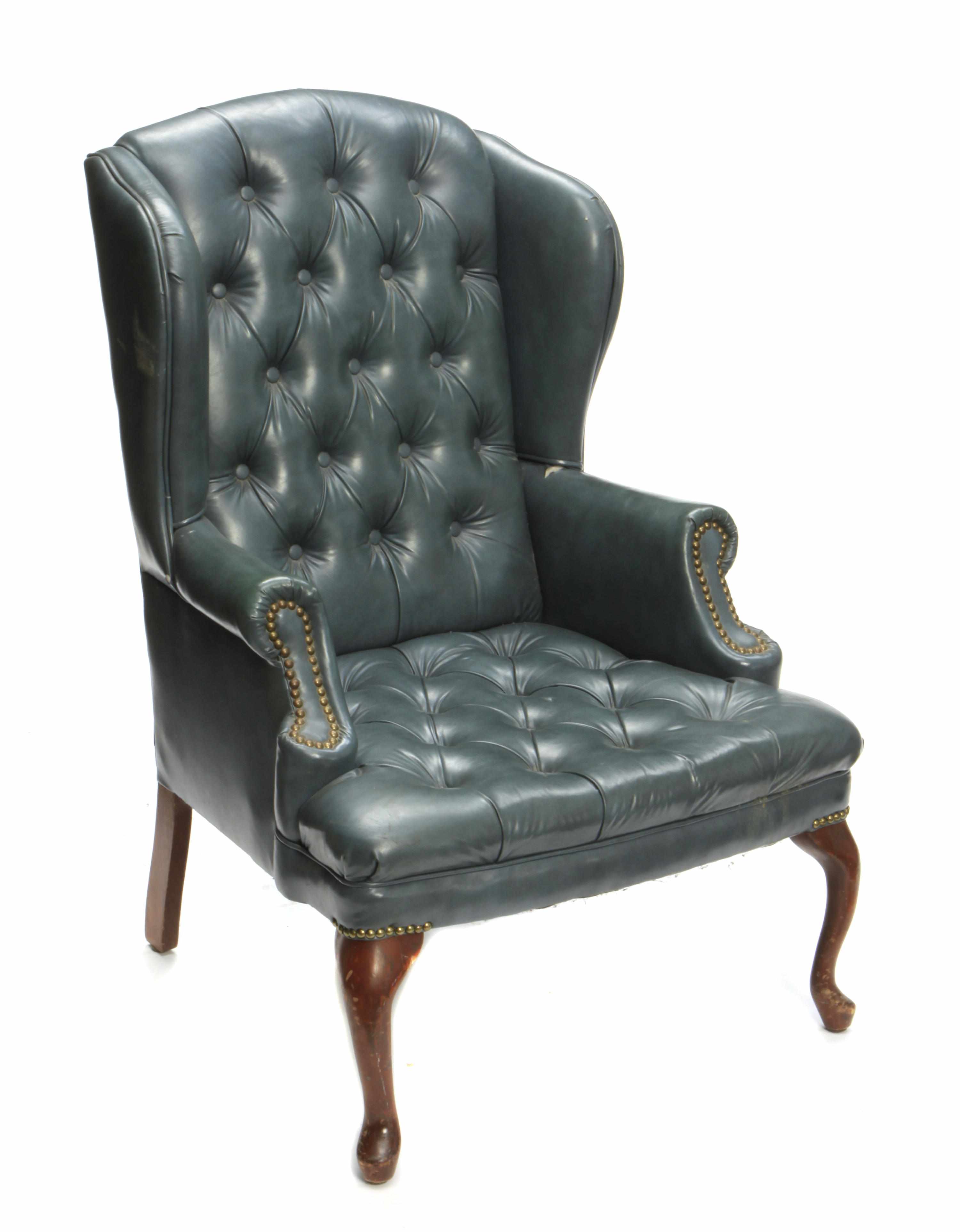 Appraisal: A Queen Anne style upholstered wing back armchair height in