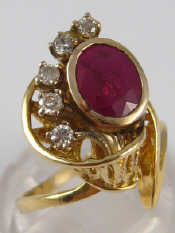 Appraisal: A yellow metal tests carat gold ruby and diamond ring