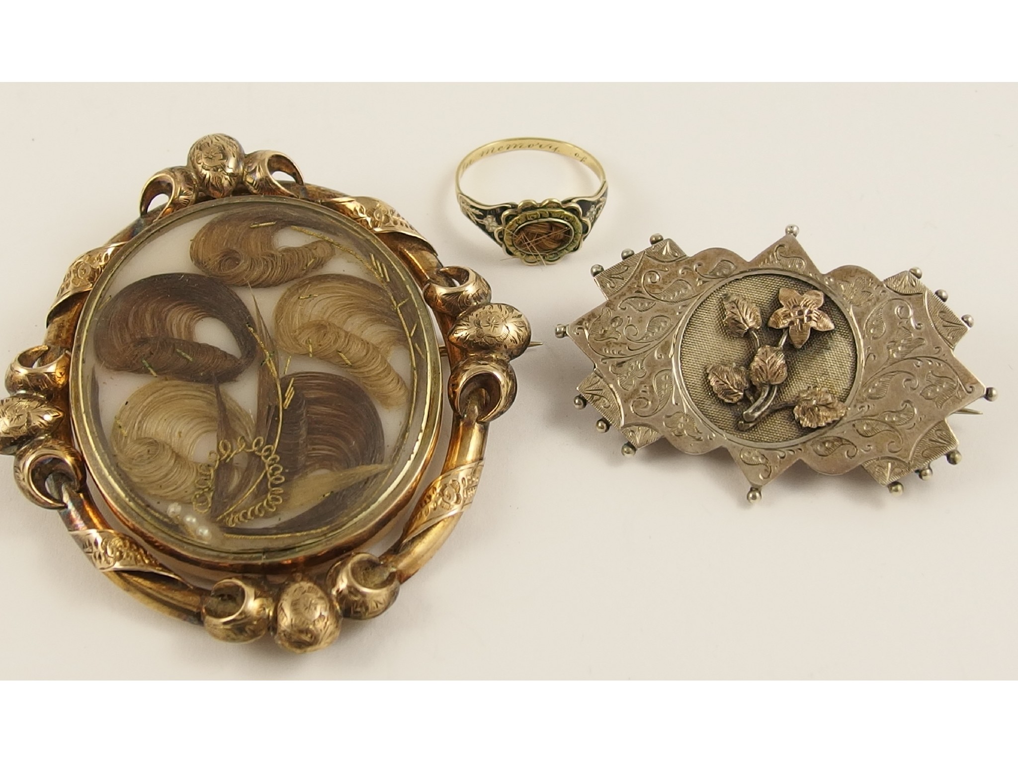 Appraisal: A Victorian hair art mourning brooch dated a hair mourning