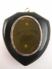 Appraisal: An onxy mourning locket pendant set with seed pearls approx