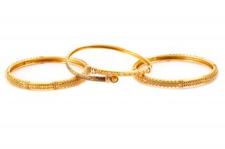 Appraisal: Three k Yellow Gold Bangle Bracelets Stamped A group of