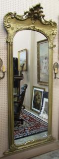 Appraisal: Description A French style antique pier mirror with gold paint