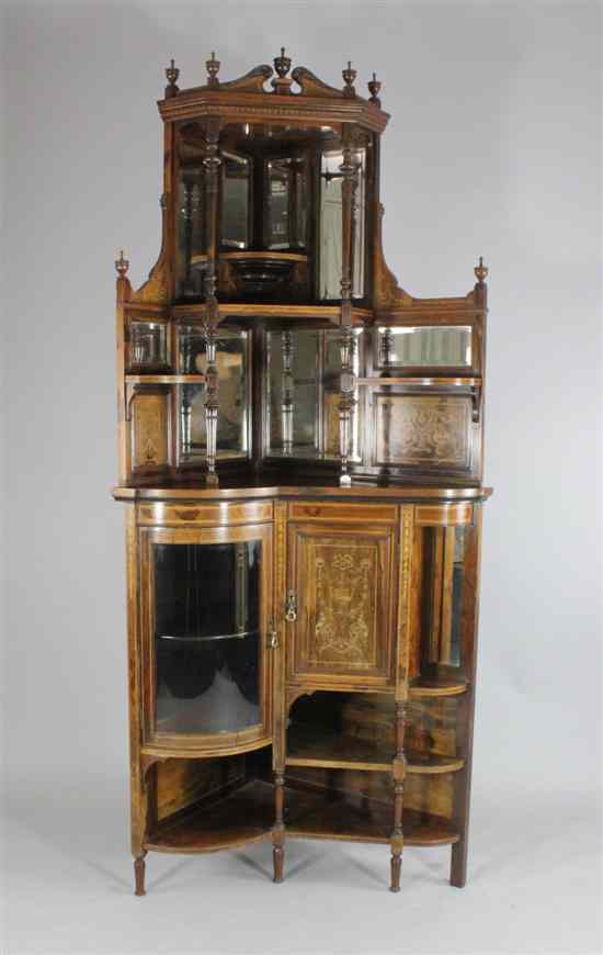 Appraisal: An Edwardian inlaid rosewood corner display cabinet with various cupboards