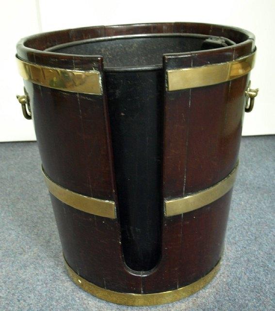 Appraisal: An th Century mahogany plate bucket with carrying handles to