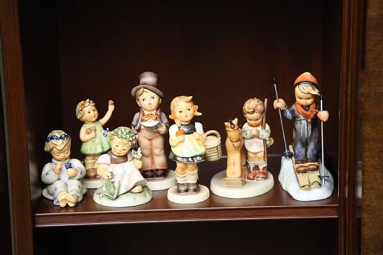 Appraisal: SEVEN HUMMEL FIGURES ''Sister'' ''Skier'' ''Garden Splendor'' ''Street Singer'' ''Prayer