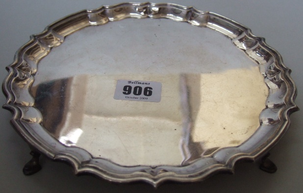 Appraisal: A silver shaped circular salver with a piecrust rim and