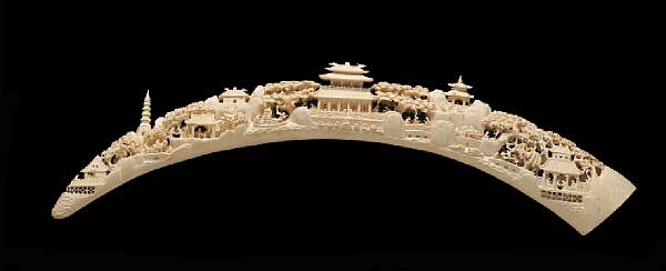 Appraisal: A reticulated ivory tusk with village and landscape decoration th