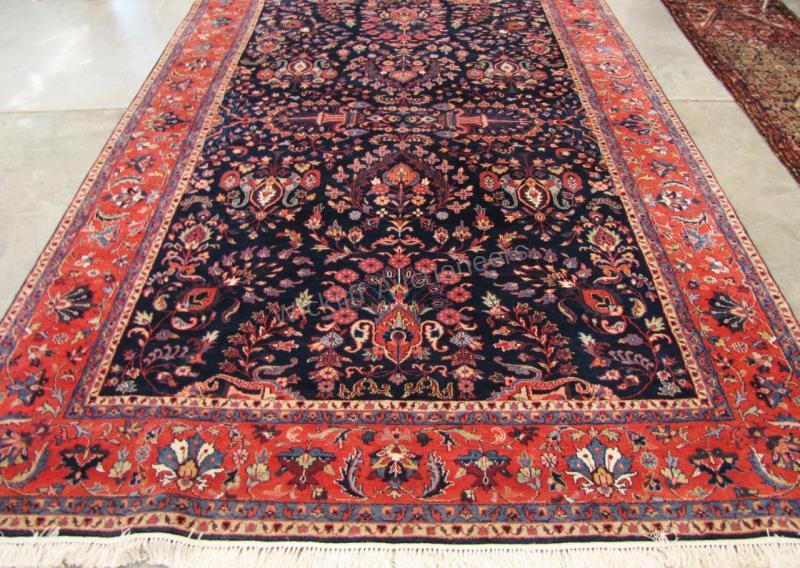 Appraisal: A handmade Oriental rug navy field with traditional Persian design