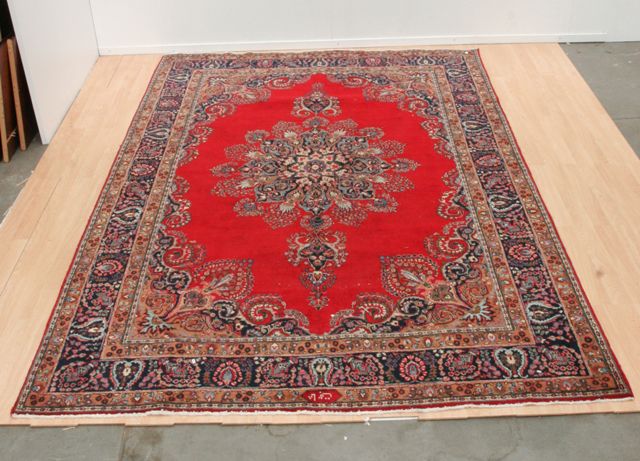 Appraisal: An Ardebil carpet with central sixteen petalled floral medallion in