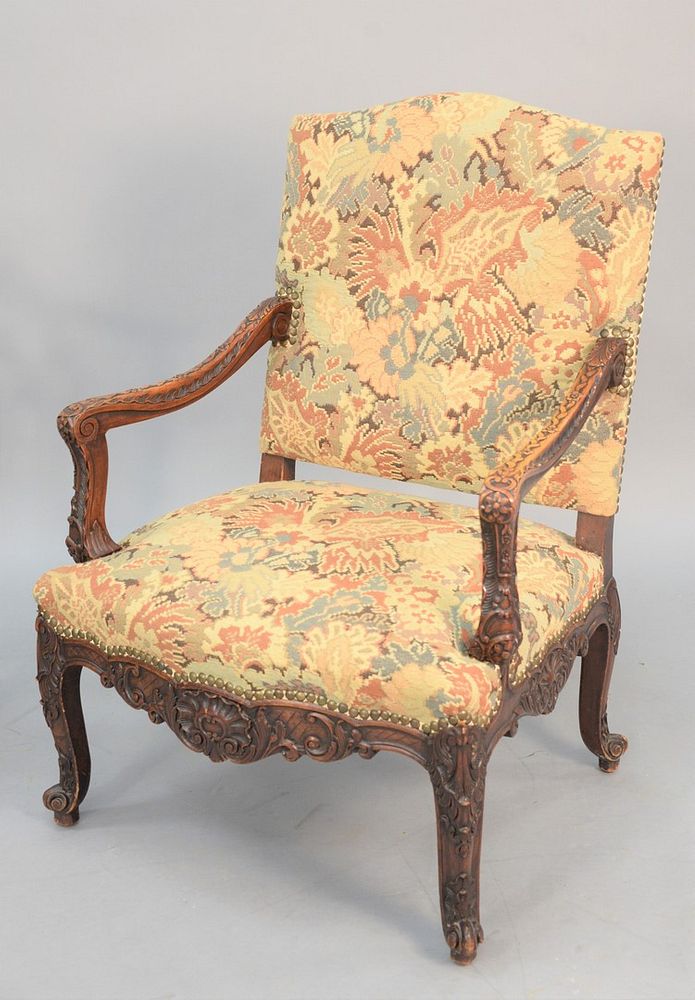 Appraisal: Heavily carved French-style armchair having needlepoint upholstery ht wd Heavily