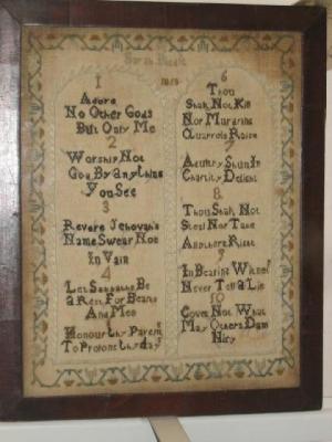 Appraisal: A NEEDLEWORK SAMPLER worked by Sarah Biddle with the Ten