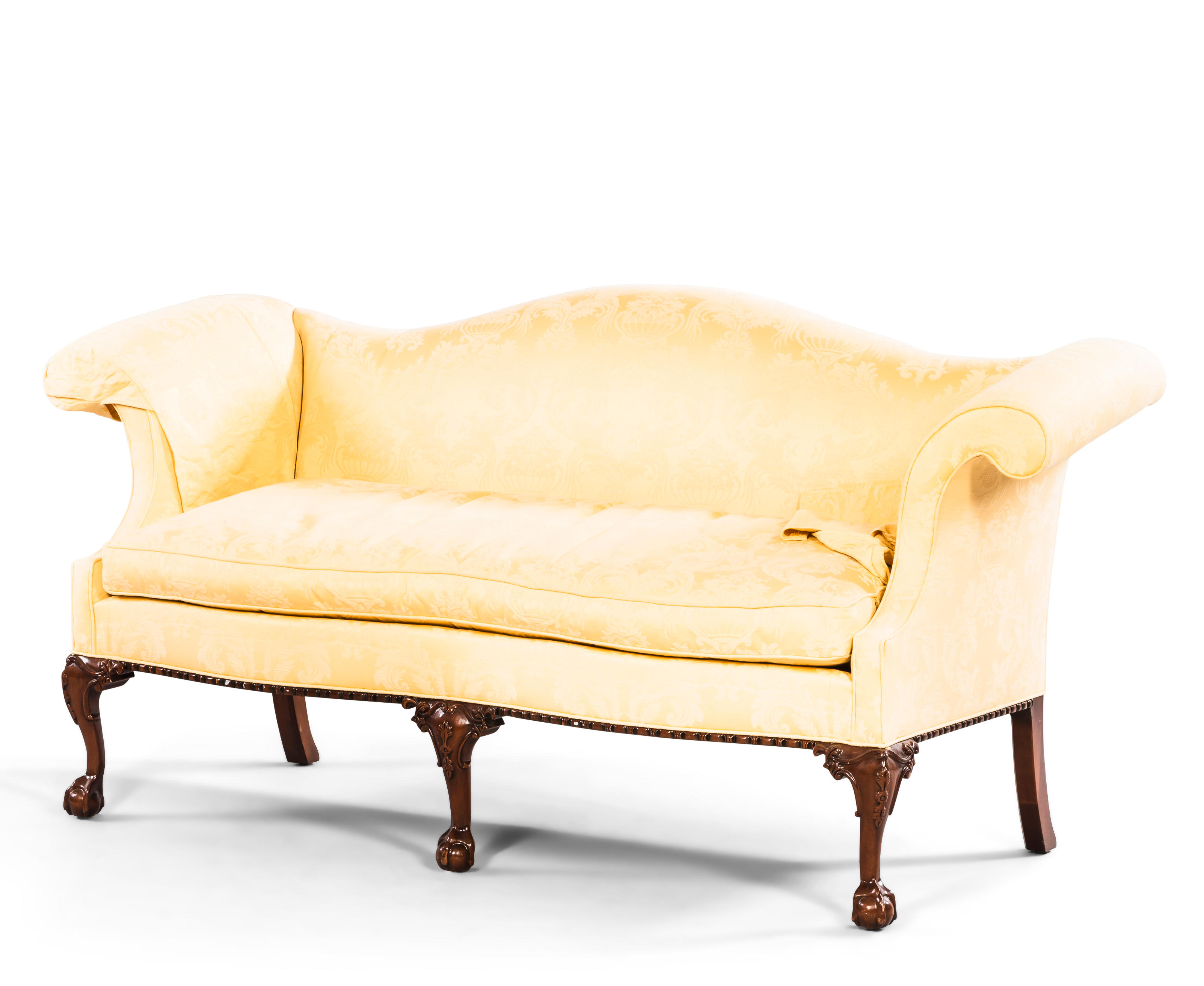 Appraisal: CHIPPENDALE-STYLE MAHOGANY AND UPHOLSTERED CAMEL-BACK SETTEE with carved legs and