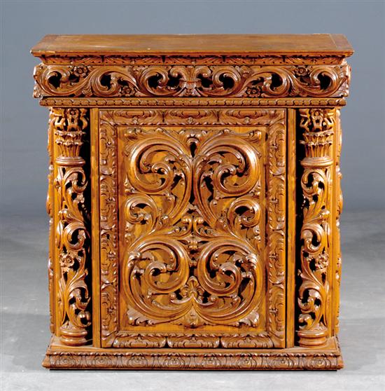 Appraisal: Rococo style carved liquor cabinet molded and carved hinged lid