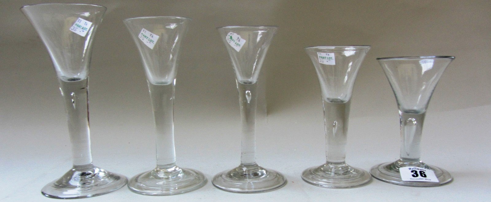 Appraisal: Five wine glasses mid th century each with drawn trumpet