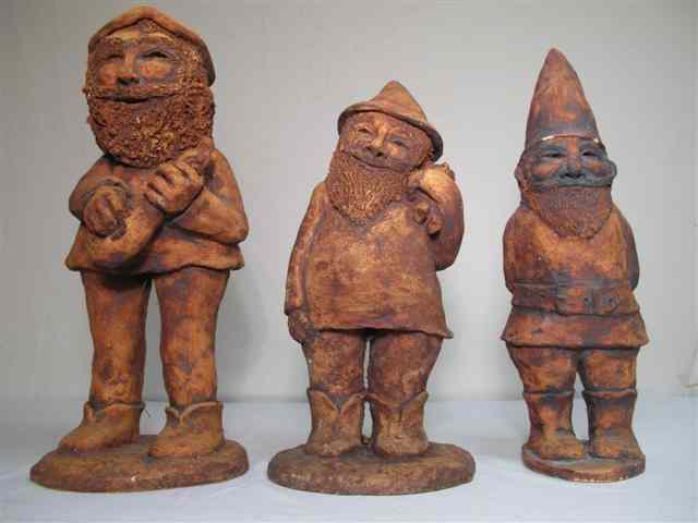 Appraisal: Three terra cotta finish garden gnomes Two signed illegibly on