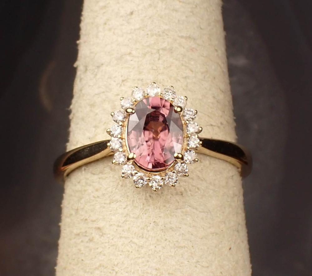 Appraisal: GARNET DIAMOND AND FOURTEEN GOLD RING with round-cut diamonds set