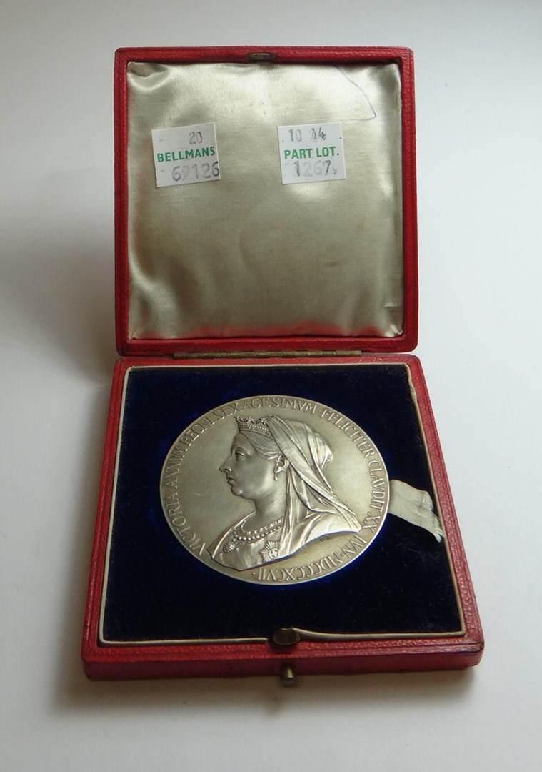 Appraisal: A Victorian silver medallion commemorating The Diamond Jubilee with the