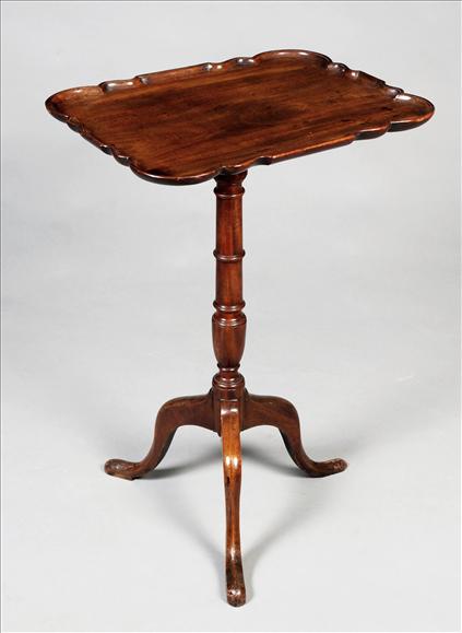 Appraisal: A George III mahogany tripod table circa the rectangular top