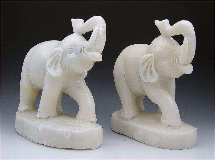 Appraisal: PAIR CHINESE CARVED WHITE SOAPSTONE ELEPHANTS ''h '' length Minor